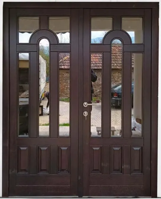 Dark brown glazed double door with round-arched glazing bars, clear glass and three small raised panels per leaf