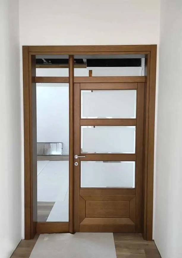 Installed glazed oak door with a transom and a side light
